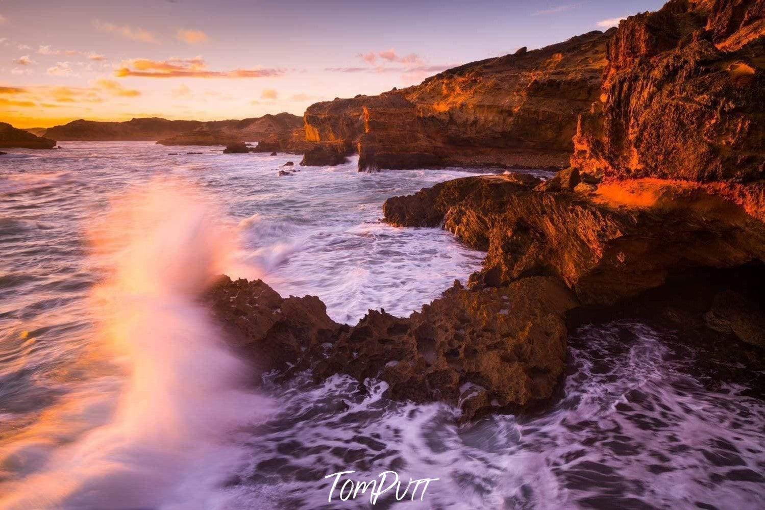 A beautiful lake corner with bubbling waves covered with a wall of the giant mountain with sunlight hitting on the scene, Crash, Sorrento - Mornington Peninsula Victoria 