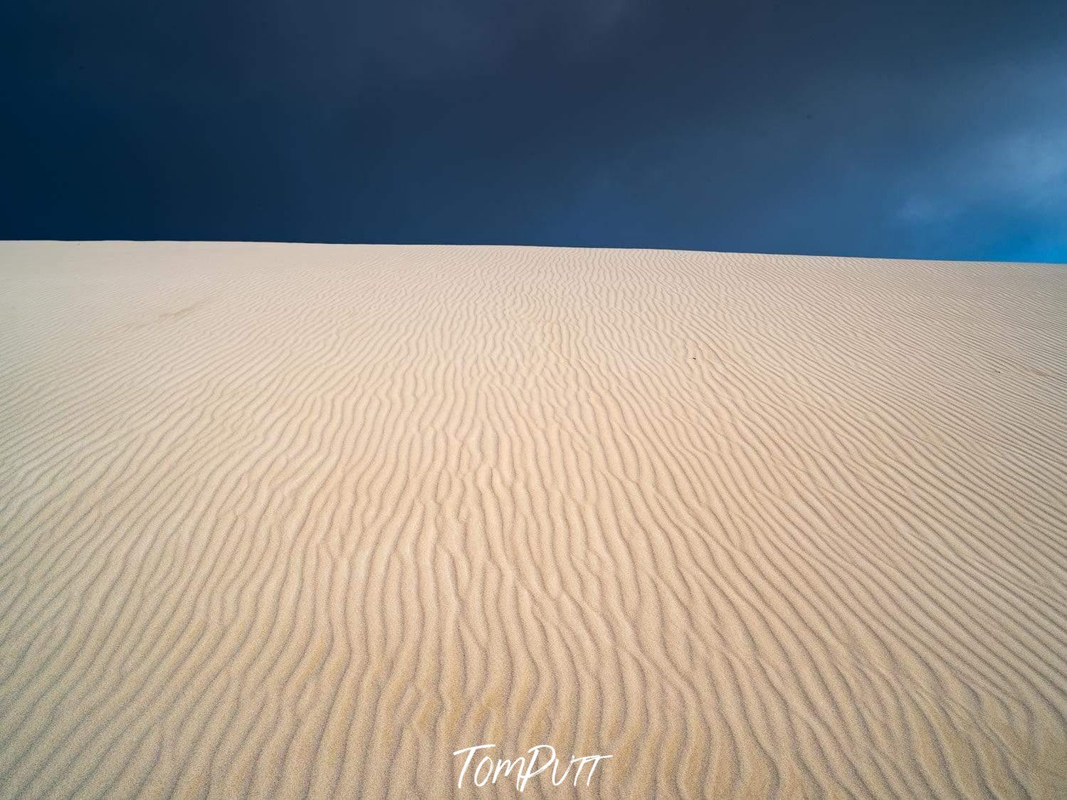 A large desert area with the natural line prints on it and a dark black sky in the far background, Desert Darkness - Kangaroo Island SA