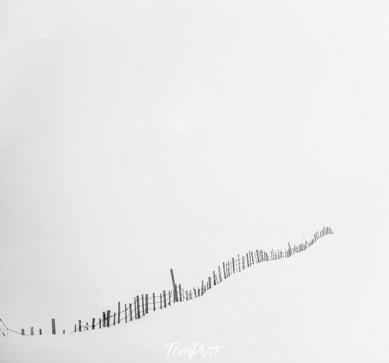 A white area fully covered in the snow but a small fence of wood is exposed, Fence Line Iceland Art