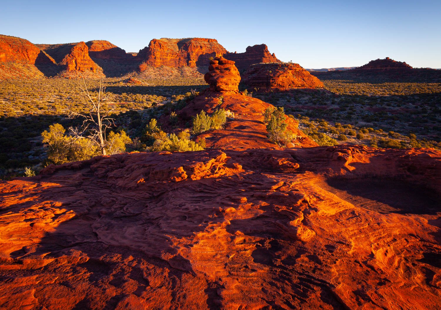 A long desert-like area with reddish mountain walls everywhere, Finke Gorge Sunset - Northern Territory