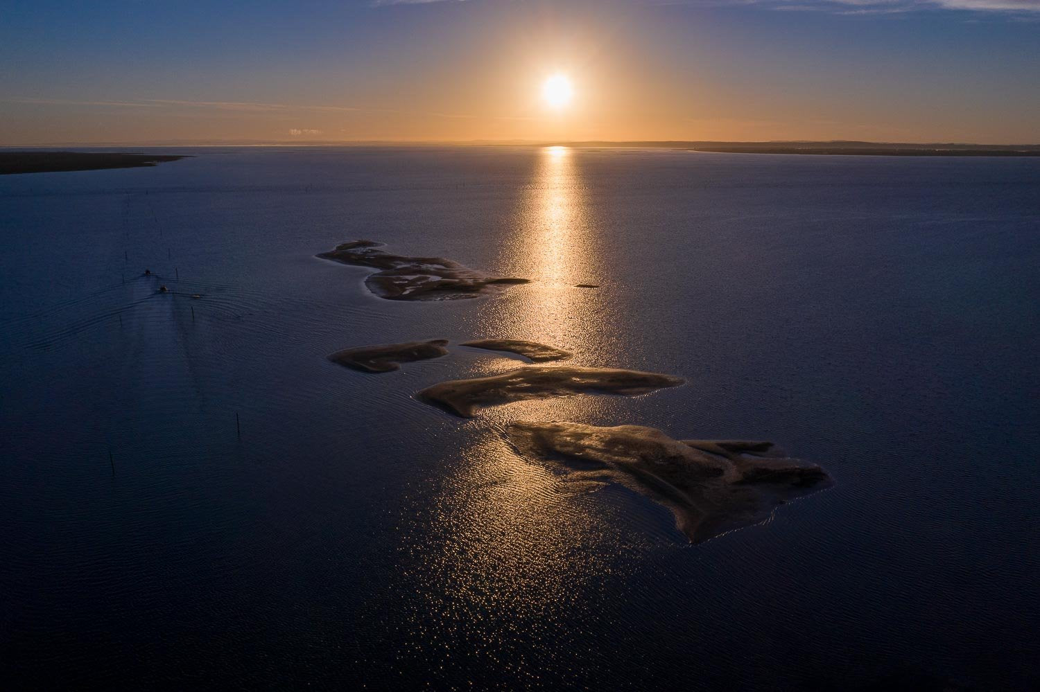 Aerial view of small sand islands in the sea with a line of sunset effect, French Island Aerial #7 - Western Port Bay