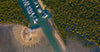 Aerial view of a large sea-port with a lot of small green trees around, French Island Aerial #9 - Western Port Bay