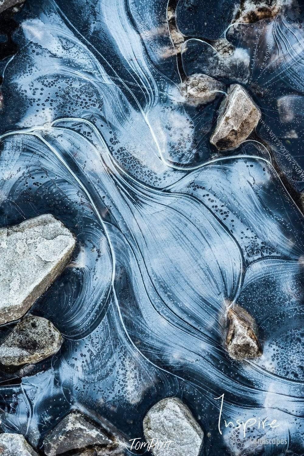 A frozen watercourse with many stones around, Frozen Pool - Cradle Mountain TAS