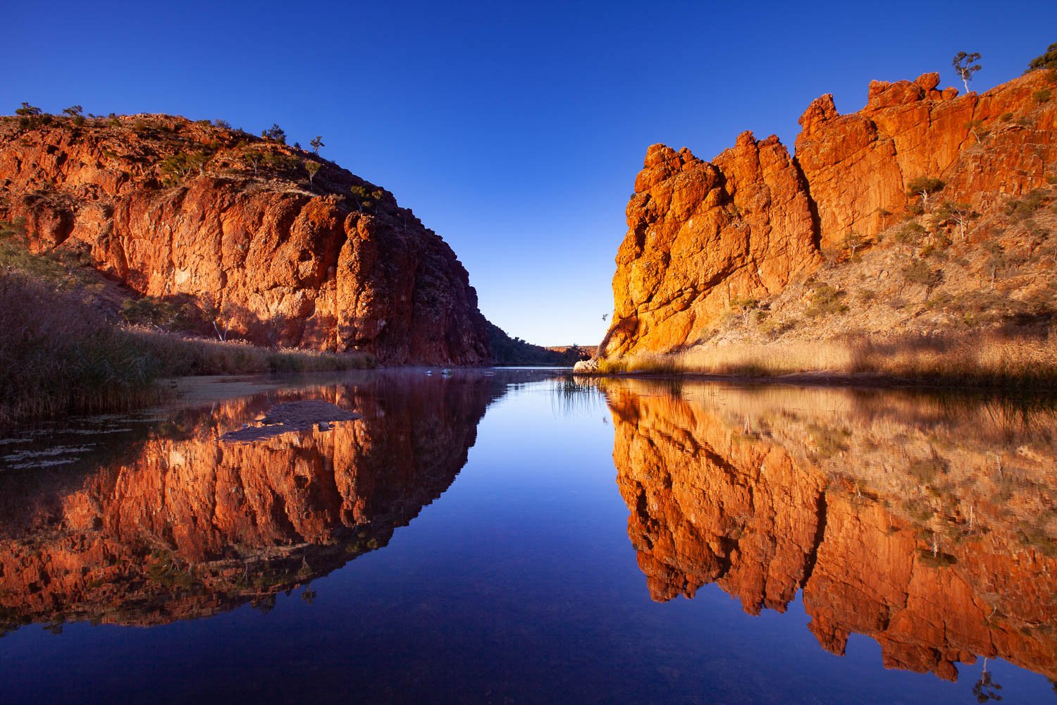 Reflection of two giant mountains in the lake, Glen Helen Gorge reflection, West MacDonnell Ranges - Northern Territory