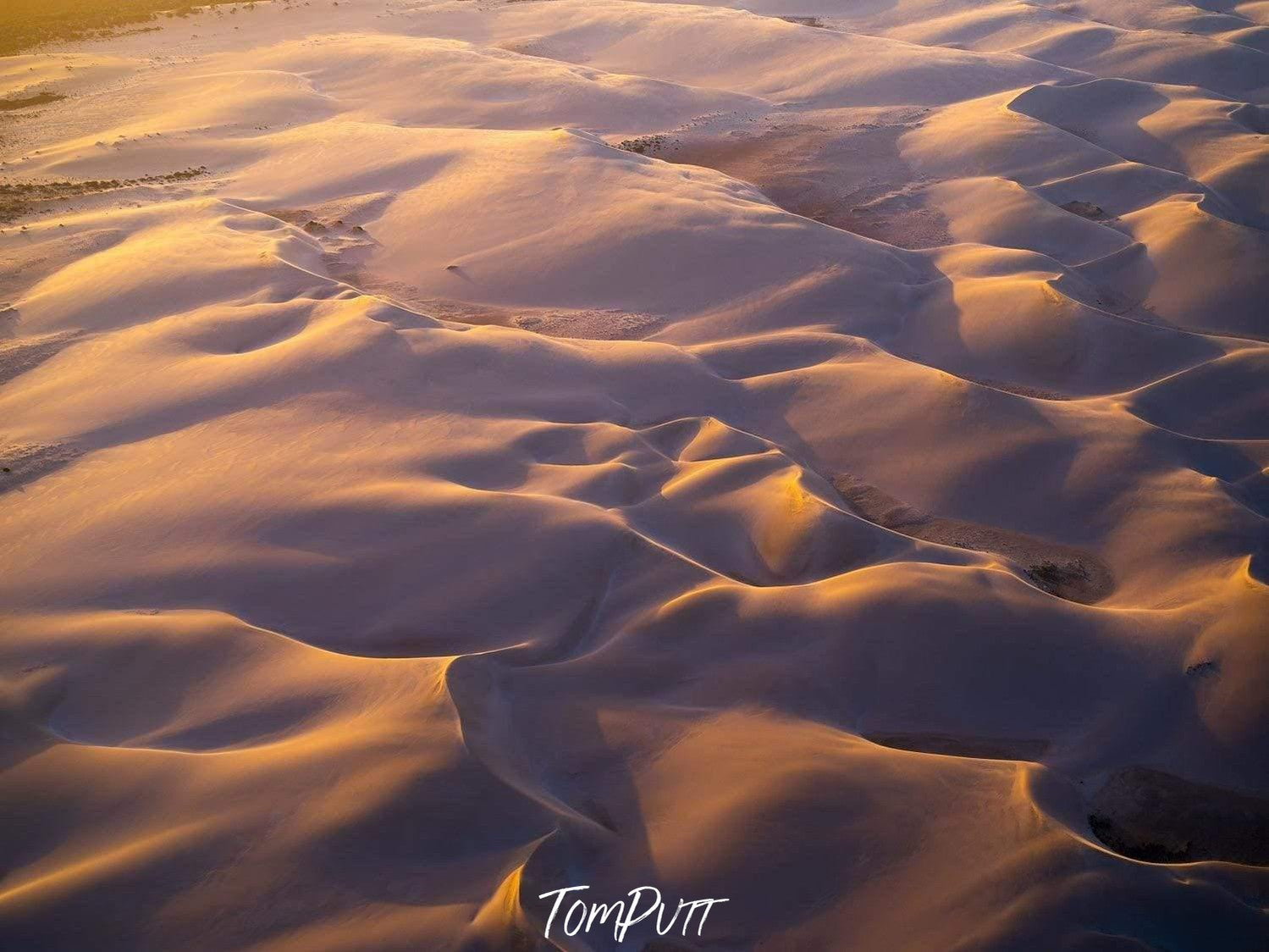 Aerial view of a desert with many waves and small mounds of sand, Golden Sands