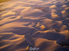 Aerial view of a desert with many waves and small mounds of sand, Golden Sands
