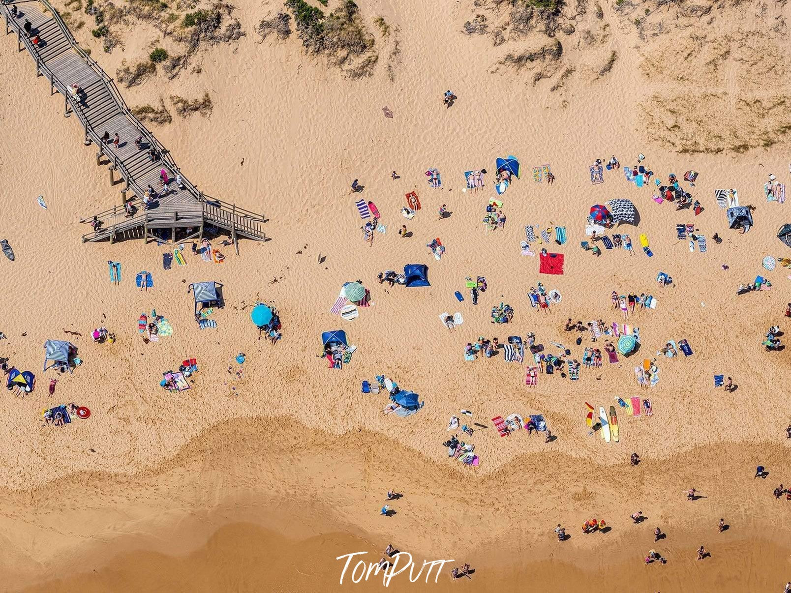 Aerial view of a seashore with many people enjoying, Gunnamatta Sunbaking - Mornington Peninsula VIC