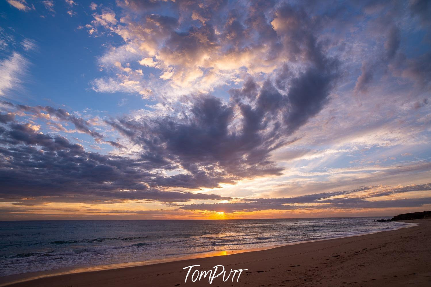 A beach with heavy giant black smoky clouds over it, Gunnamatta Sunset - Mornington Peninsula VIC 