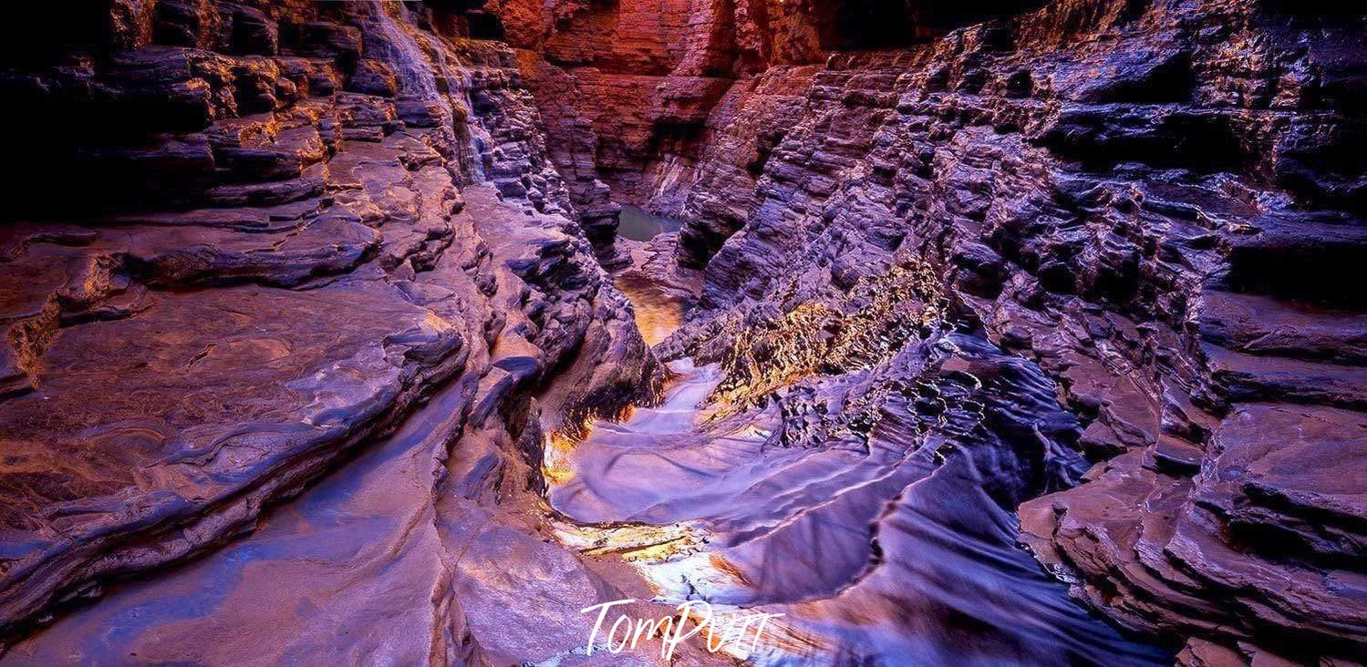 A dense water flow over a stone area, Hancock Shute - Karijini, The Pilbara