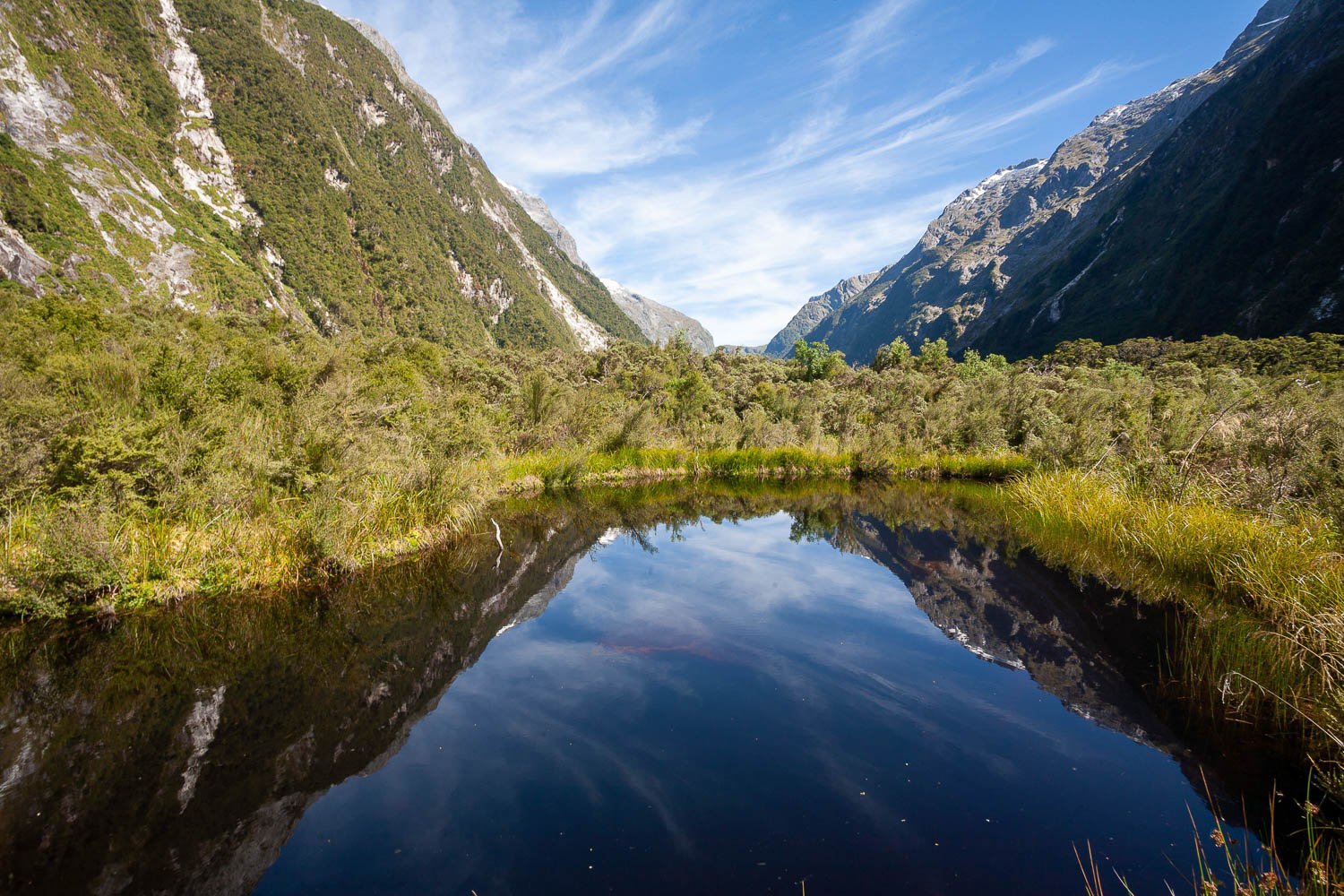 A small lake of clear water hidden within the course of two big mountains, Hidden Lake, Clinton Valley, Milford Track - New Zealand