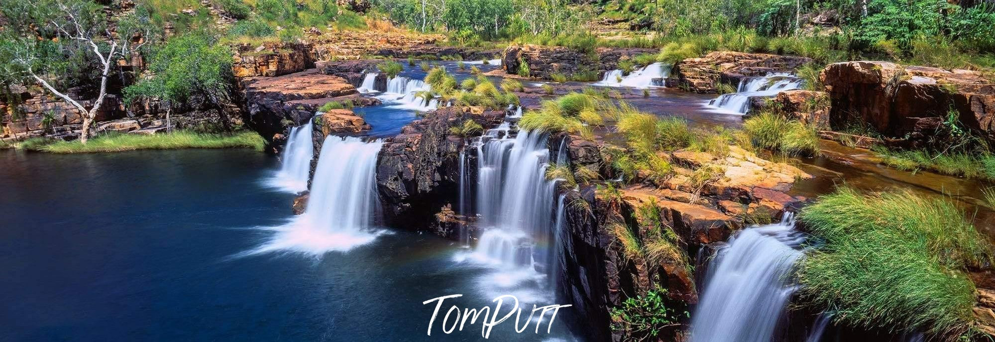 Waterfalls from a mountain wall in a lake, Hollywood Falls Panorama, The Kimberley, Western Australia