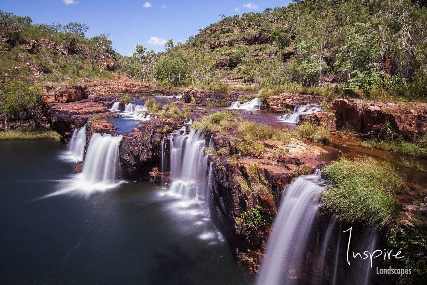 Waterfalls from a mountain wall in a lake, Hollywood Falls, The Kimberley, Western Australia