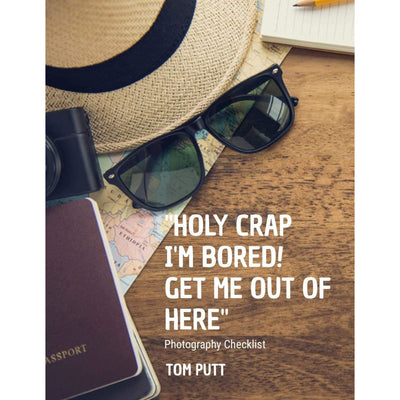 An E-book cover with a hat, sunglasses, passport, camera, and a map depicting a travel guide. 