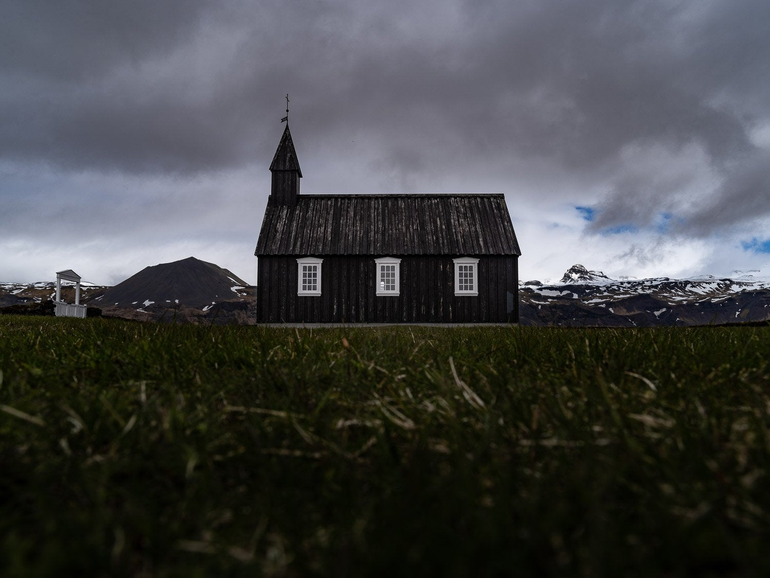 A house in a park and some heavy rain clouds over it, Iceland #29