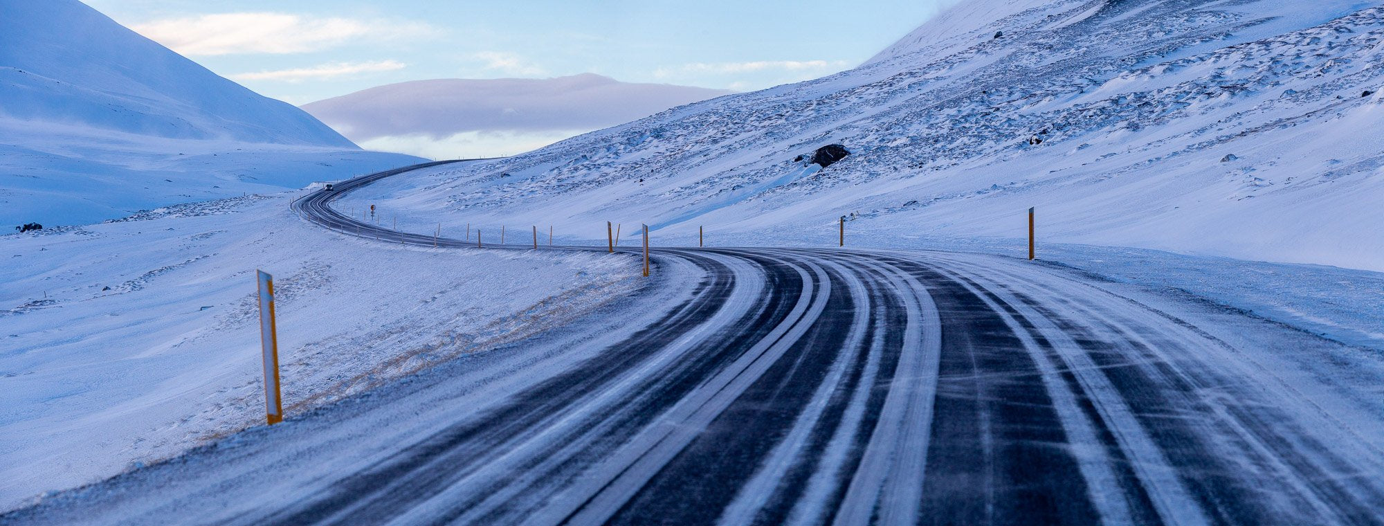 A wide road between the snowy land and mountains, Iceland #4