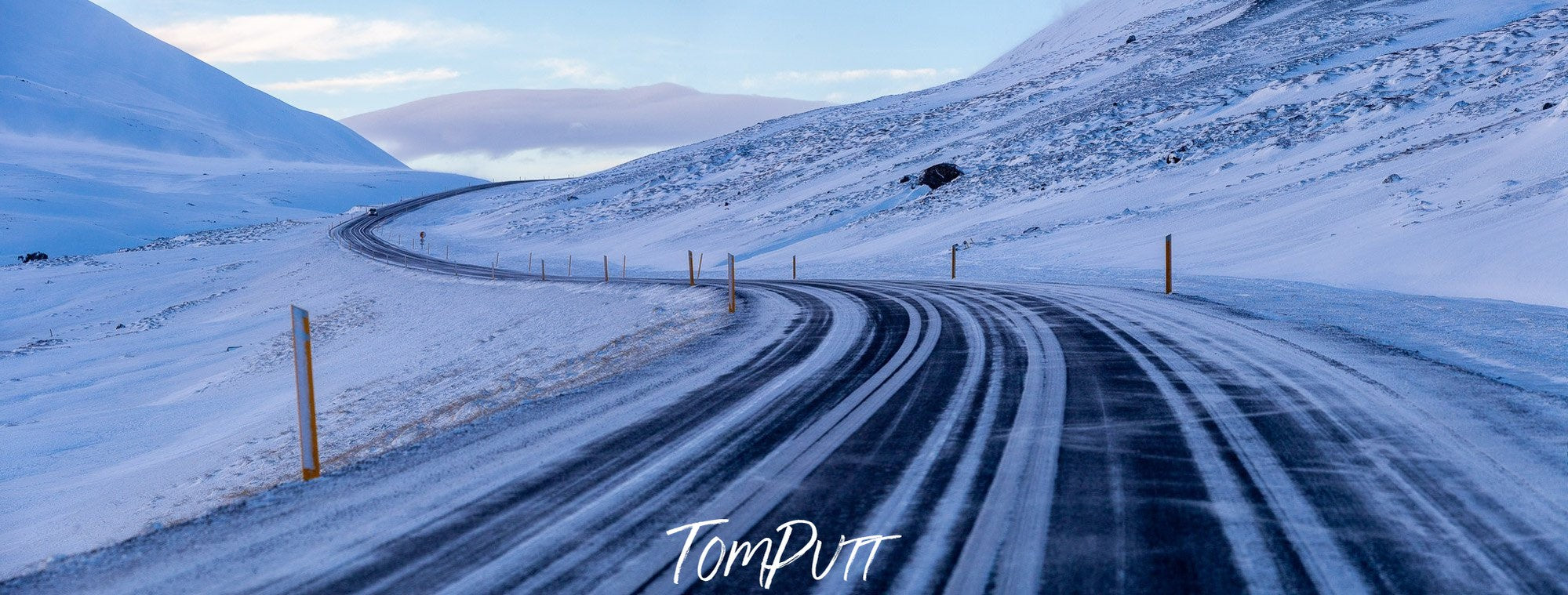 A wide road between the snowy land and mountains, Iceland #4