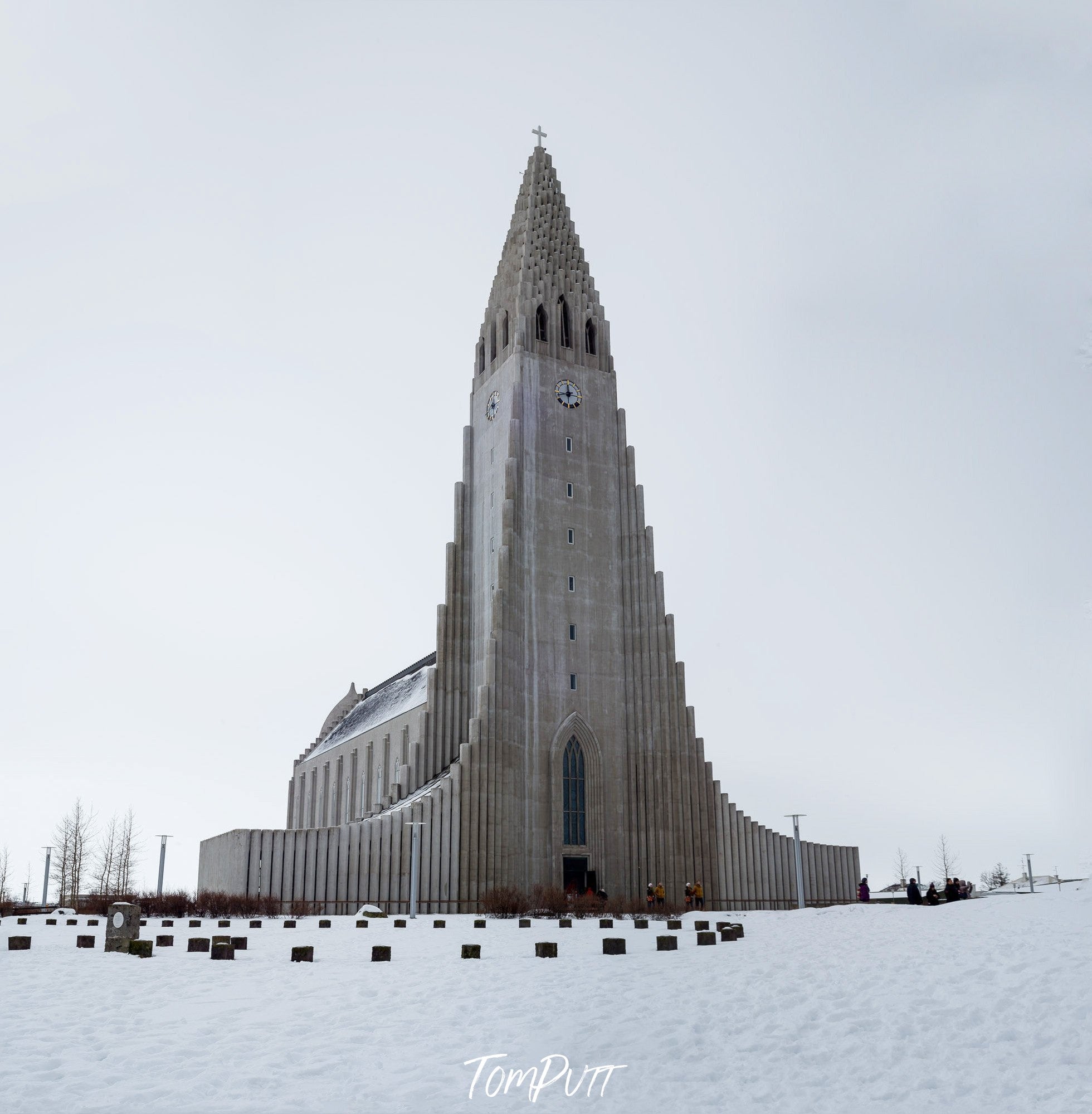 A large clock tower on the surface of snow-covered area, Iceland #7