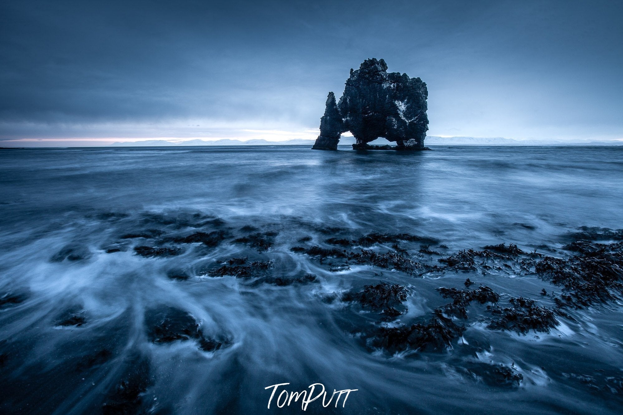 A large dark black standing stone in the sea, Iceland No.9