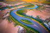 A curvy line watercourse and bushes, with dry land around, Island Home Kimberley Art