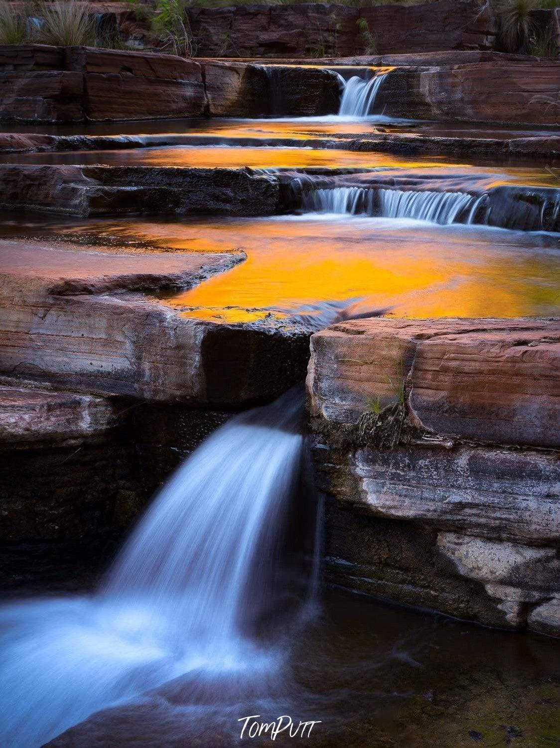 Glowing mountain downstairs with a clear flow of water, Karijini Reflections - Karijini, The Pilbara