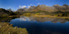 Beautiful series of mountains with a lake ahead of them, a reflection of mountains in the lake with a clear sky, Key Summit Reflection, Routeburn Track - New Zealand
