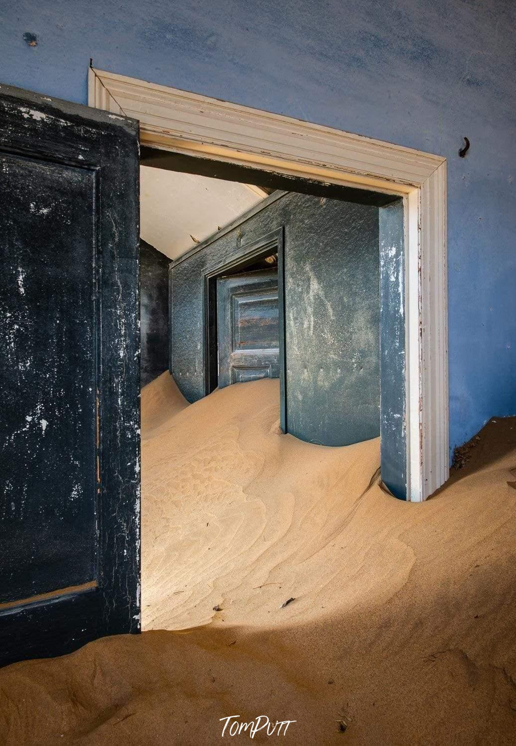 Making of a house room with open doors and a lot of construction sand inside, Kolmanskop No.29