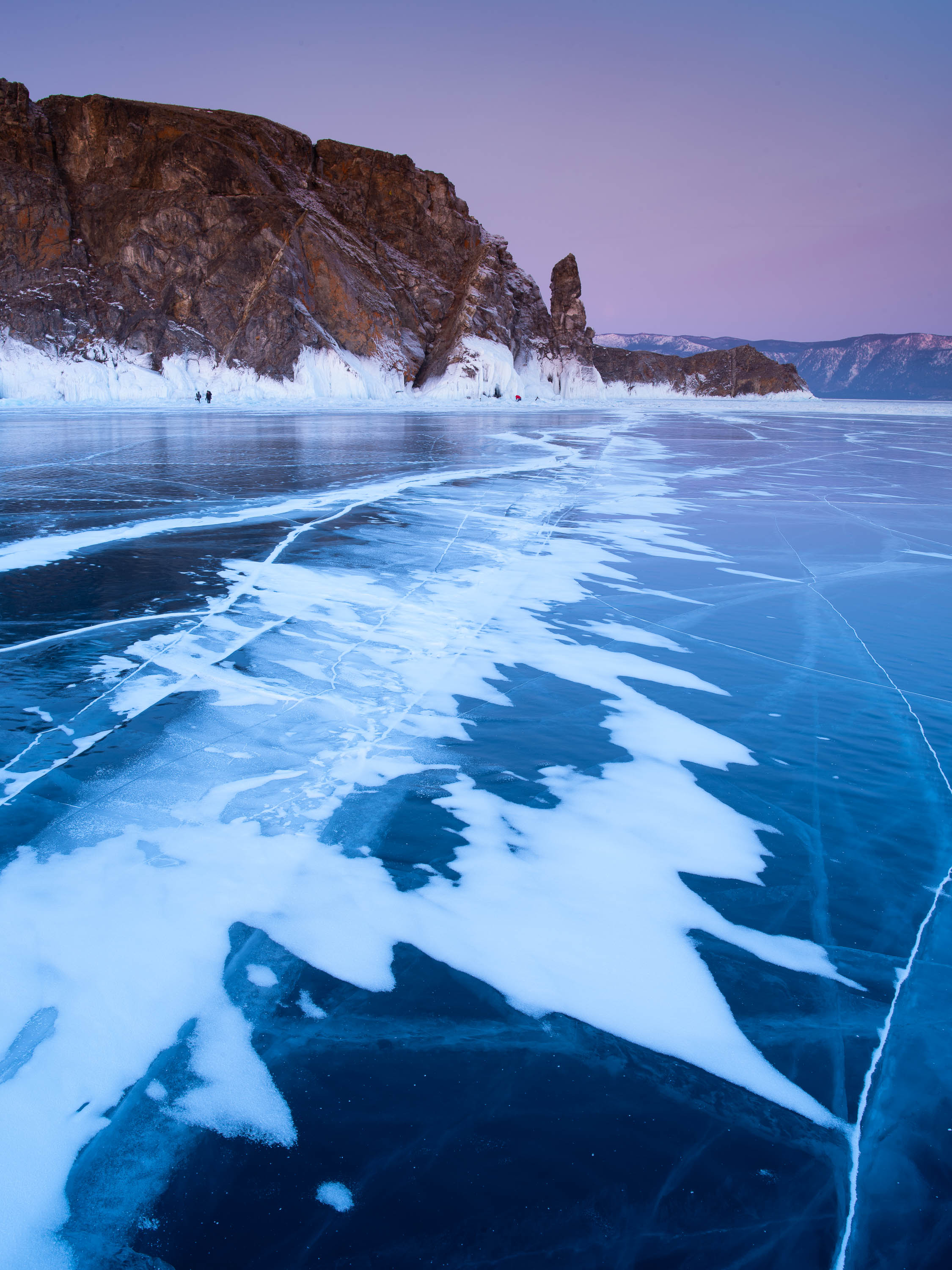 Frozen lake with a large black mountain in the background, Lake Baikal #1, Siberia, Russia 