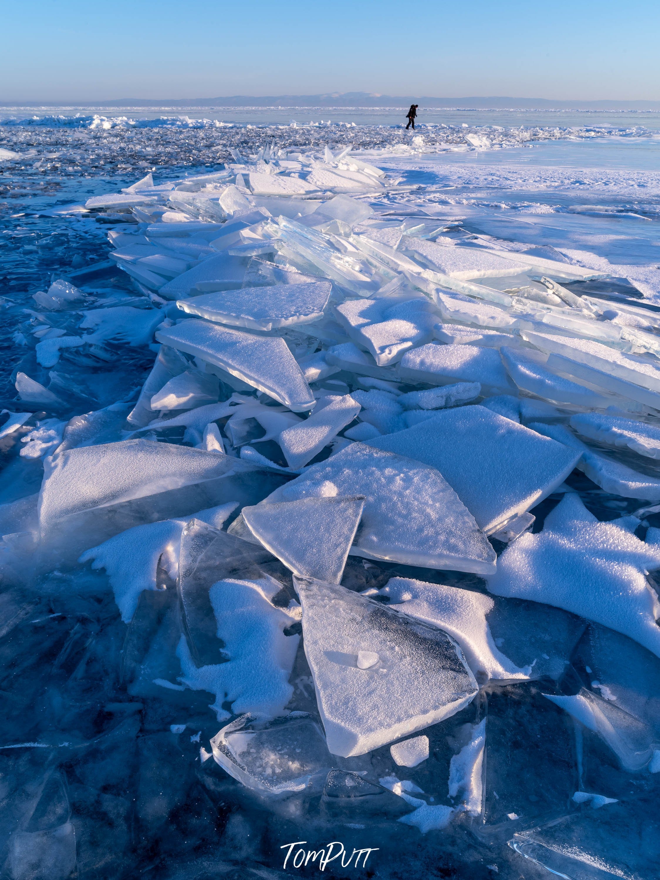 Crystalline glass-like ice pieces on a fully snow-covered land, Lake Baikal #12, Siberia, Russia