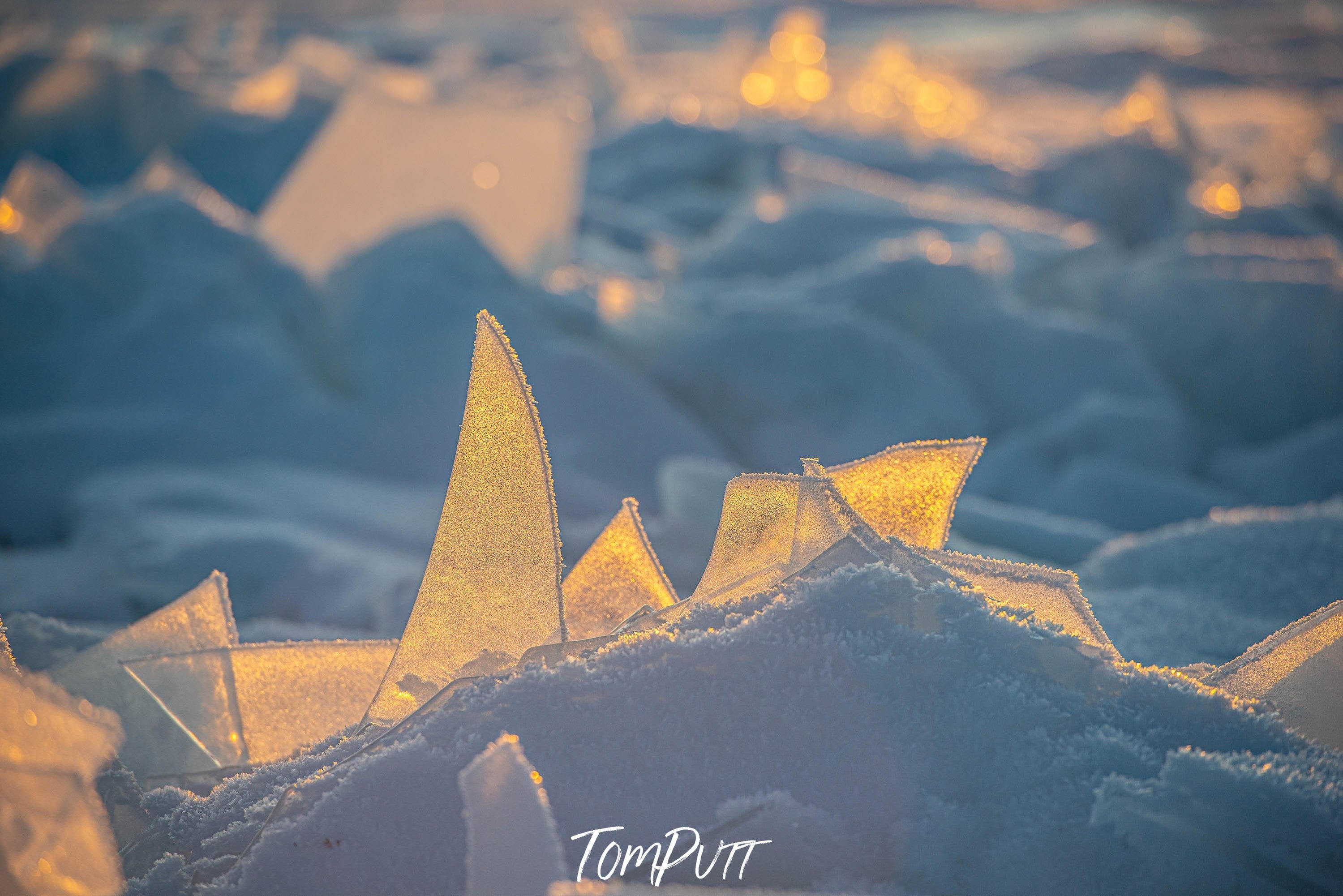 Close-up shot of sharp pieces of ice penetrating inside a soft snow mound, Lake Baikal #16, Siberia, Russia