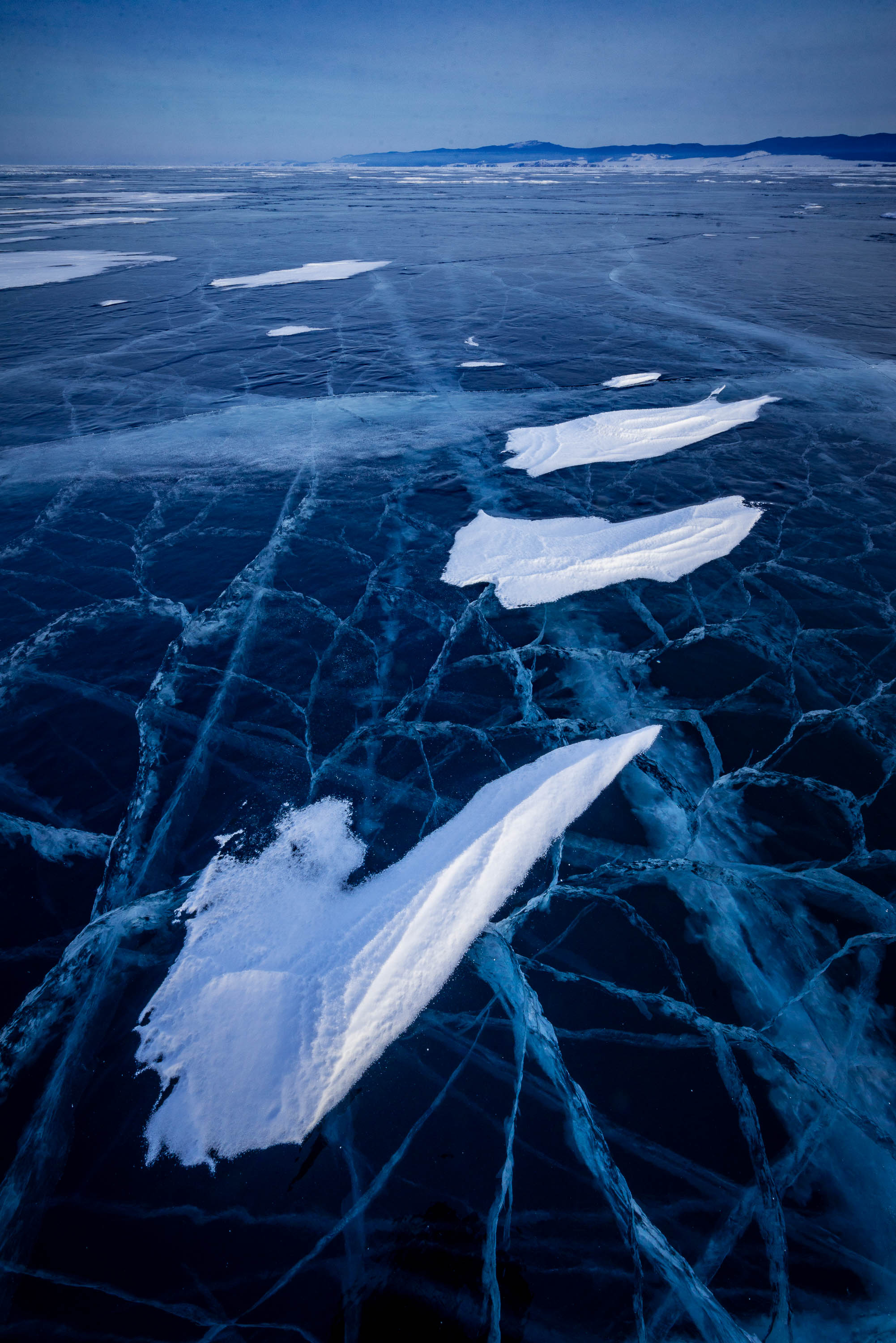 A frozen lake with some fresh snow, Lake Baikal #29, Siberia, Russia