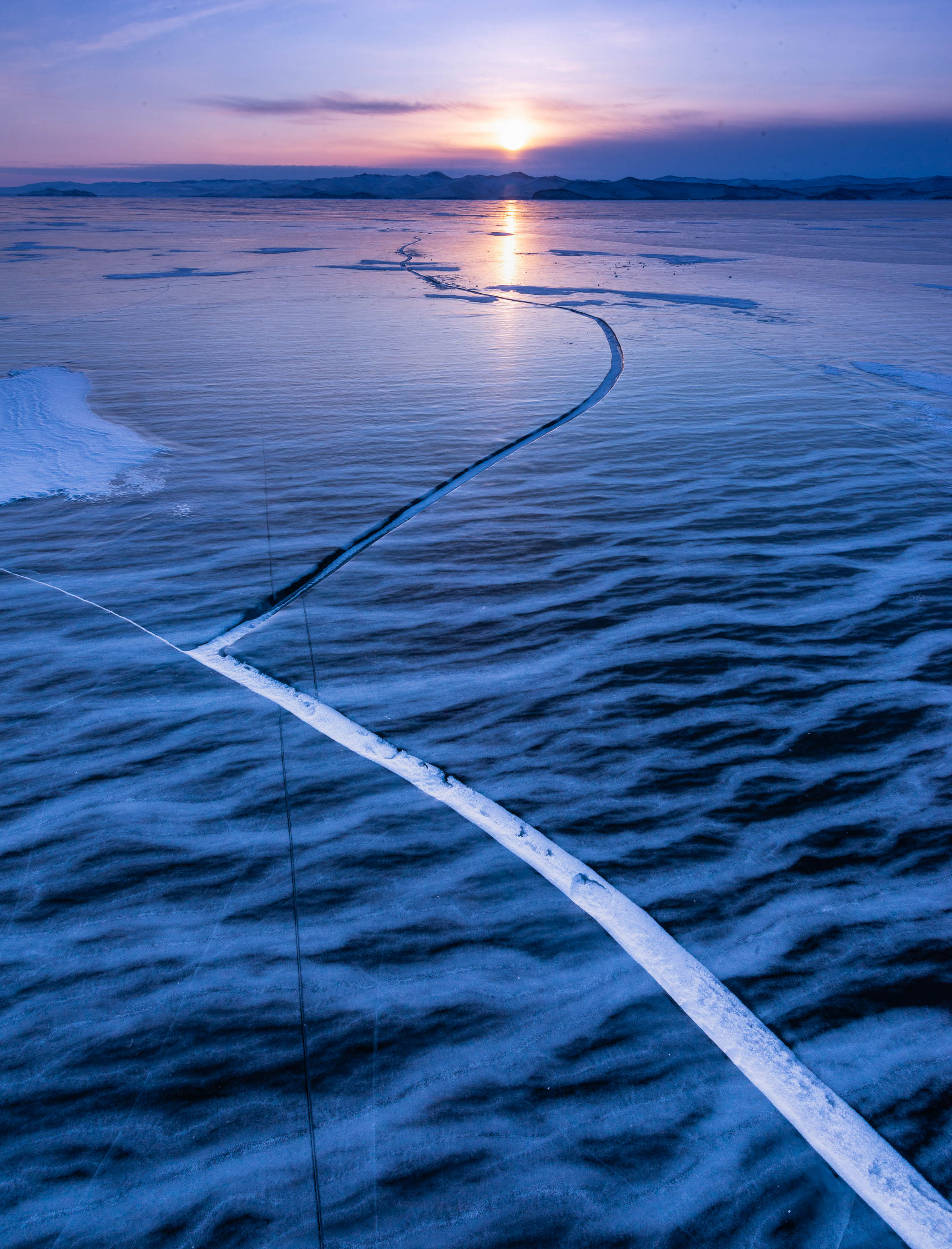 A cold lake with a long infinite line following the sun, Lake Baikal #39, Siberia, Russia