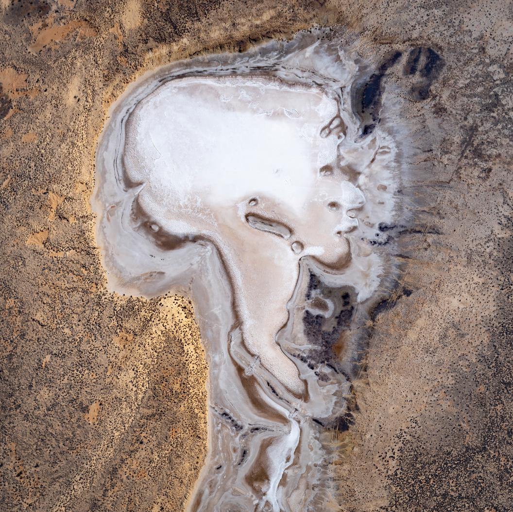 A white-colored human head-like shape on a land, Lake Eyre Lady