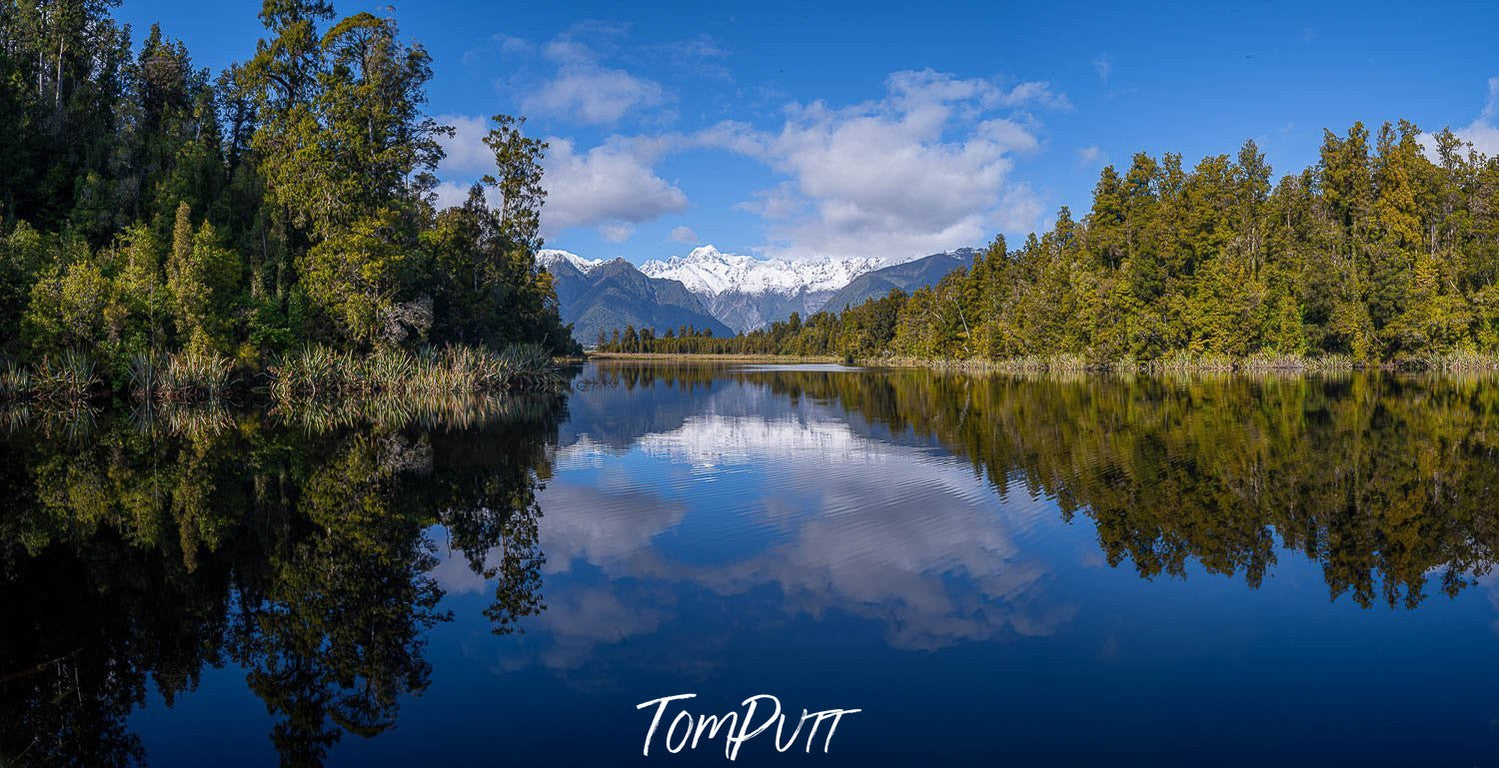 Lake with greenery around, and a clear reflection in the water, New Zealand #20