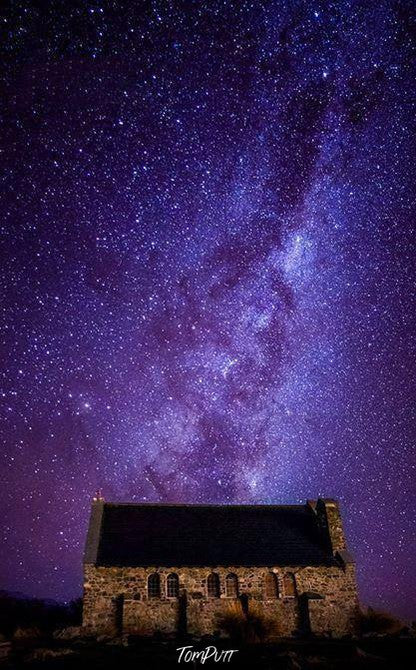 A fort-like house with a dark purple sky full of stars over, Tekapo Stars New Zealand Art