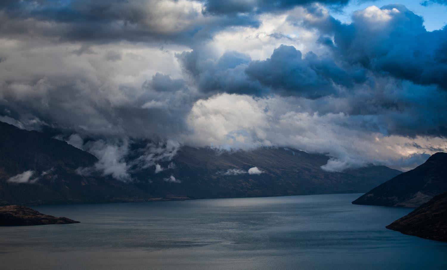Dark view of a lake covered with thick black dense clouds, Lake Wakatipu - New Zealand