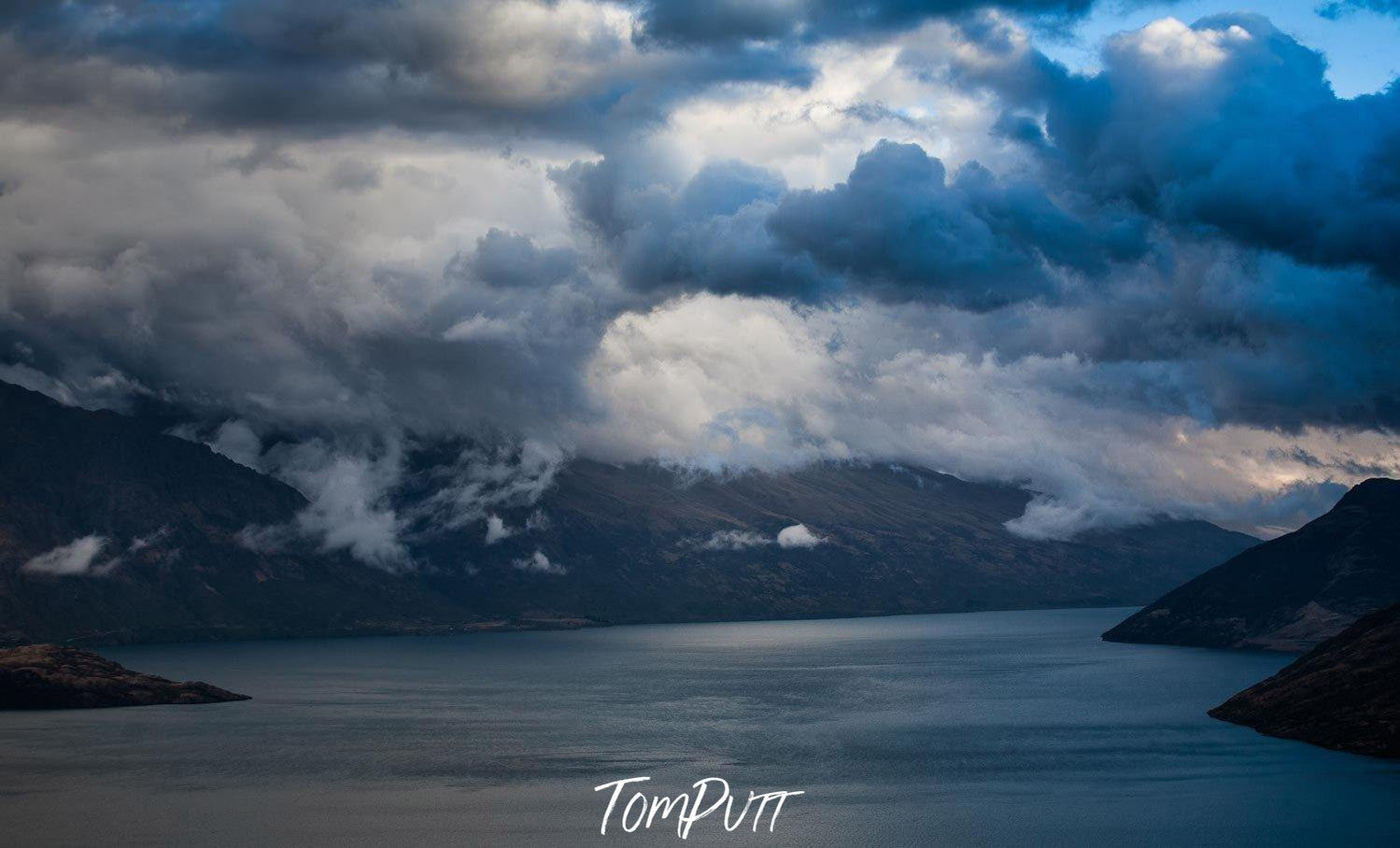 Dark view of a lake covered with thick black dense clouds, Lake Wakatipu - New Zealand