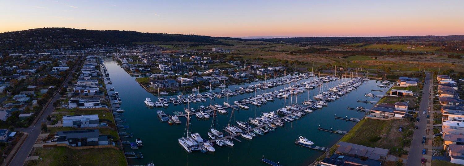 Aerial view of the coast of the sea with a lot of boats standing, Last Light, Martha Cove - Mornington Peninsula VIC