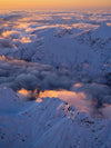 A drone shot of the walls of large mountains fully covered with snow, and a sunset view, Last Light Southern Alps Art