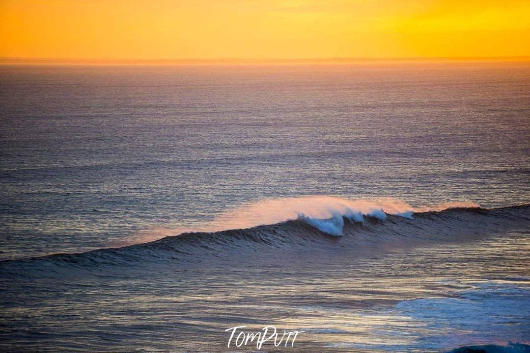 A large view of a wave in a sea with a sunset effect besides, Last Wave, Portsea 