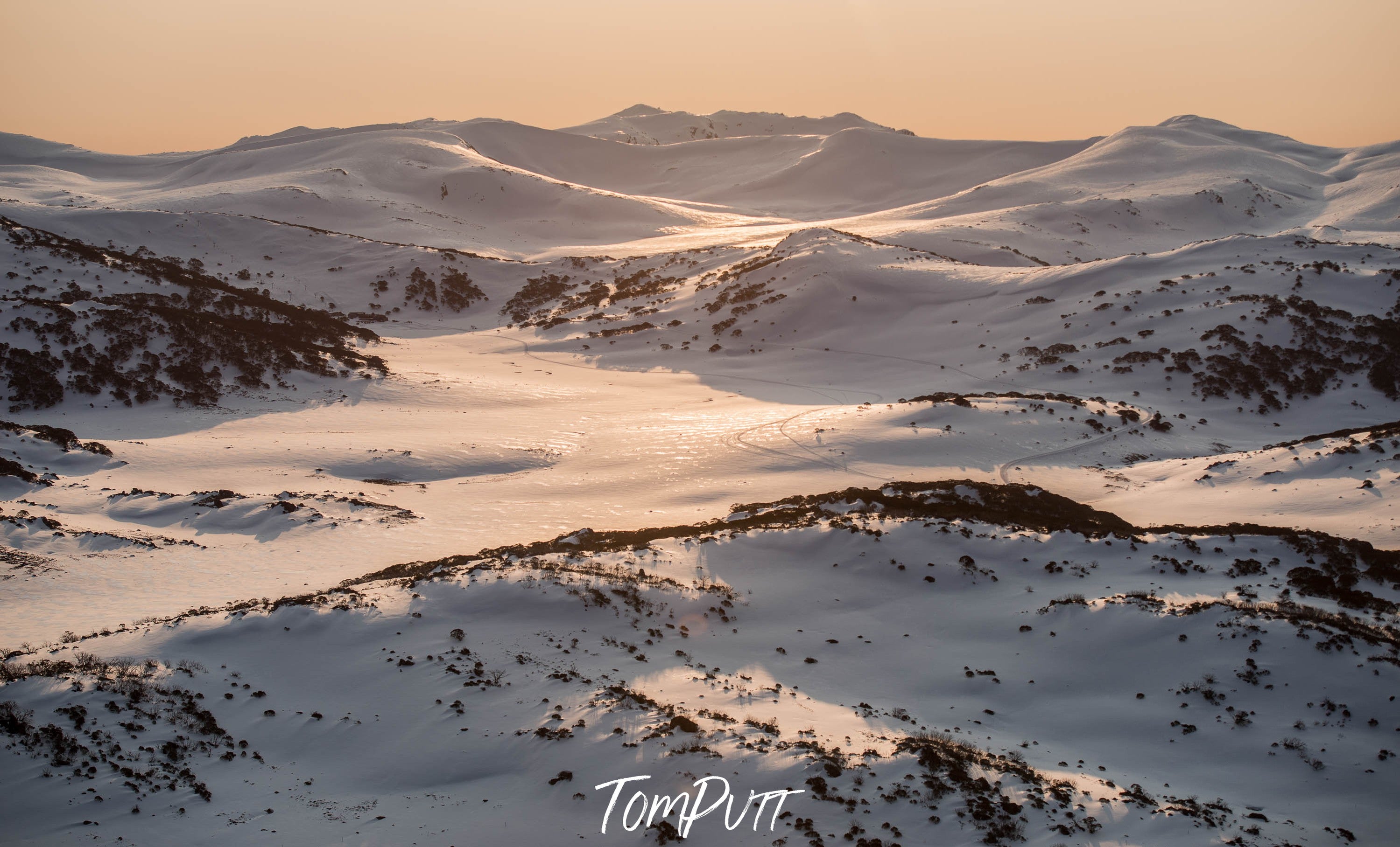 The sequence of a snow-covered mountains, with a little a lite effect of the sun of late afternoon, Late Afternoon Light over the Snowy Mountains, New South Wales