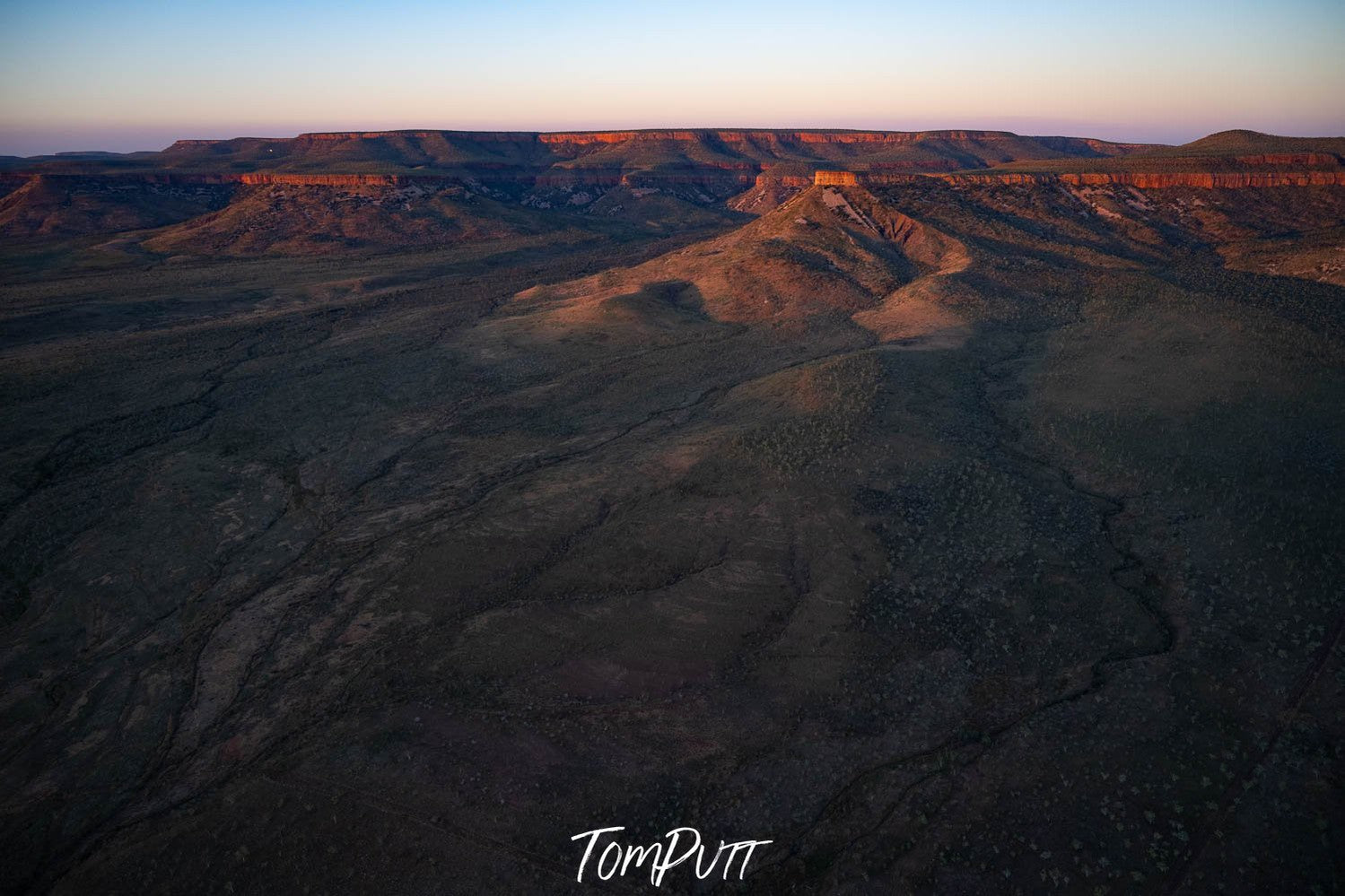 A large mountainy land area with some mounds and a partially hitting sunlight, Late Light, Carr Boyd Ranges, The Kimberley