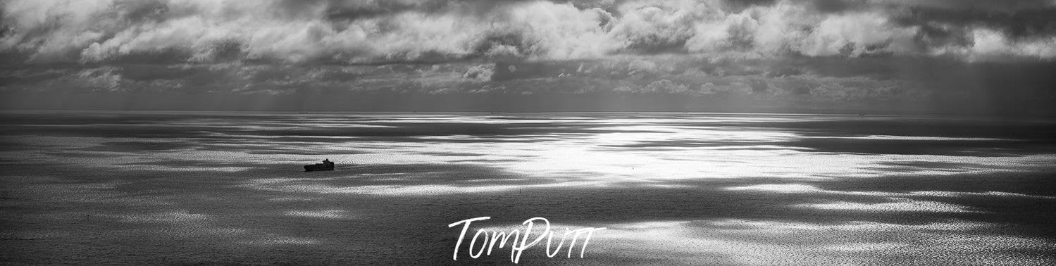 Dark view of a lake with stormy mountains over, Light across Port Phillip Bay from Arthurs Seat - Mornington Peninsula, VIC