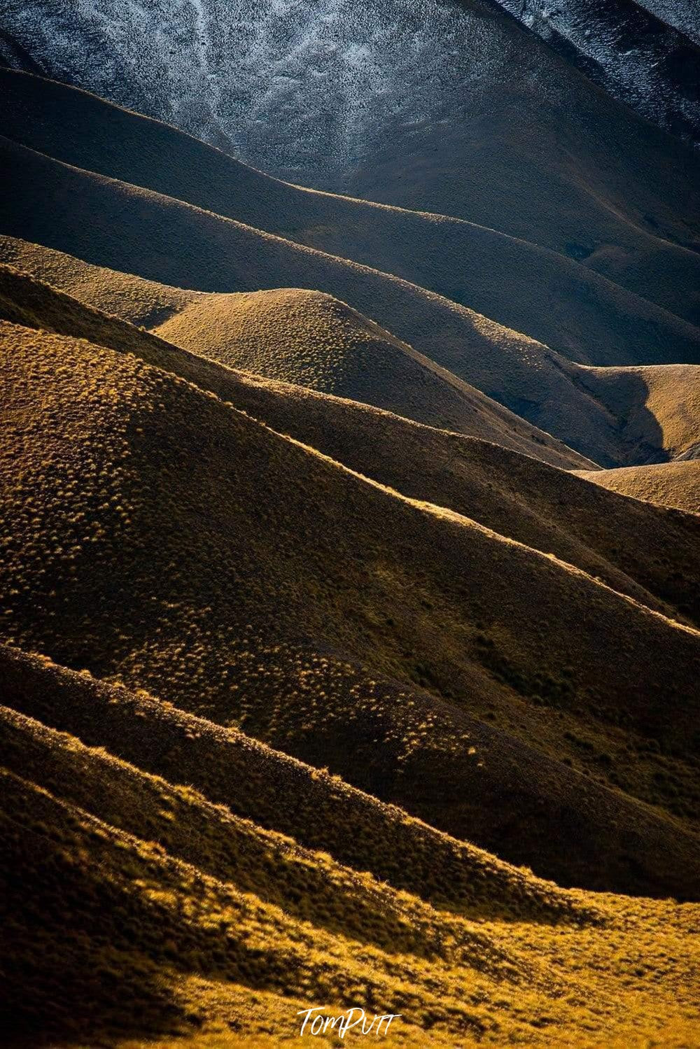 A shiny view of large yellow mountains with heavy storm weather, Lindis Hills New Zealand Artwork