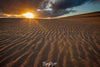 A desert with giant black clouds over with lite sunlight rays, Little Sahara Sunset - Kangaroo Island SA