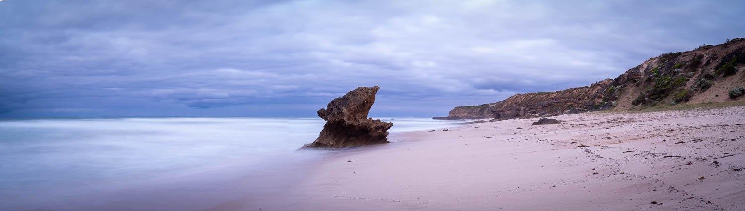 A large mountain standing in the middle of a sea with cool and clear atmosphere, Lizard Rock, Rye - Mornington Peninsula VIC