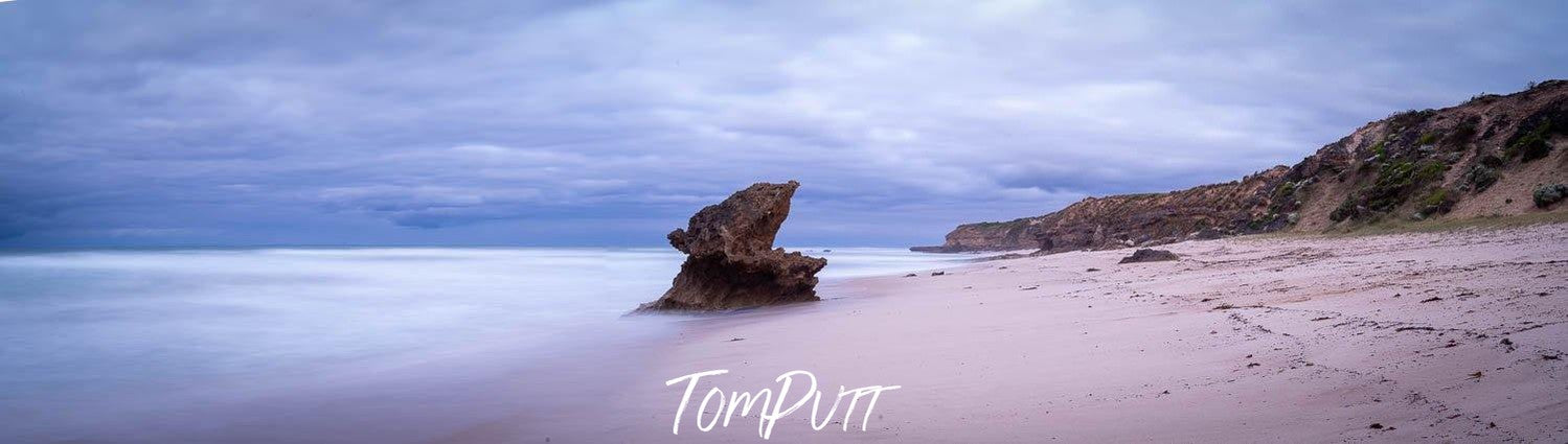 A large mountain standing in the middle of a sea with cool and clear atmosphere, Lizard Rock, Rye - Mornington Peninsula VIC