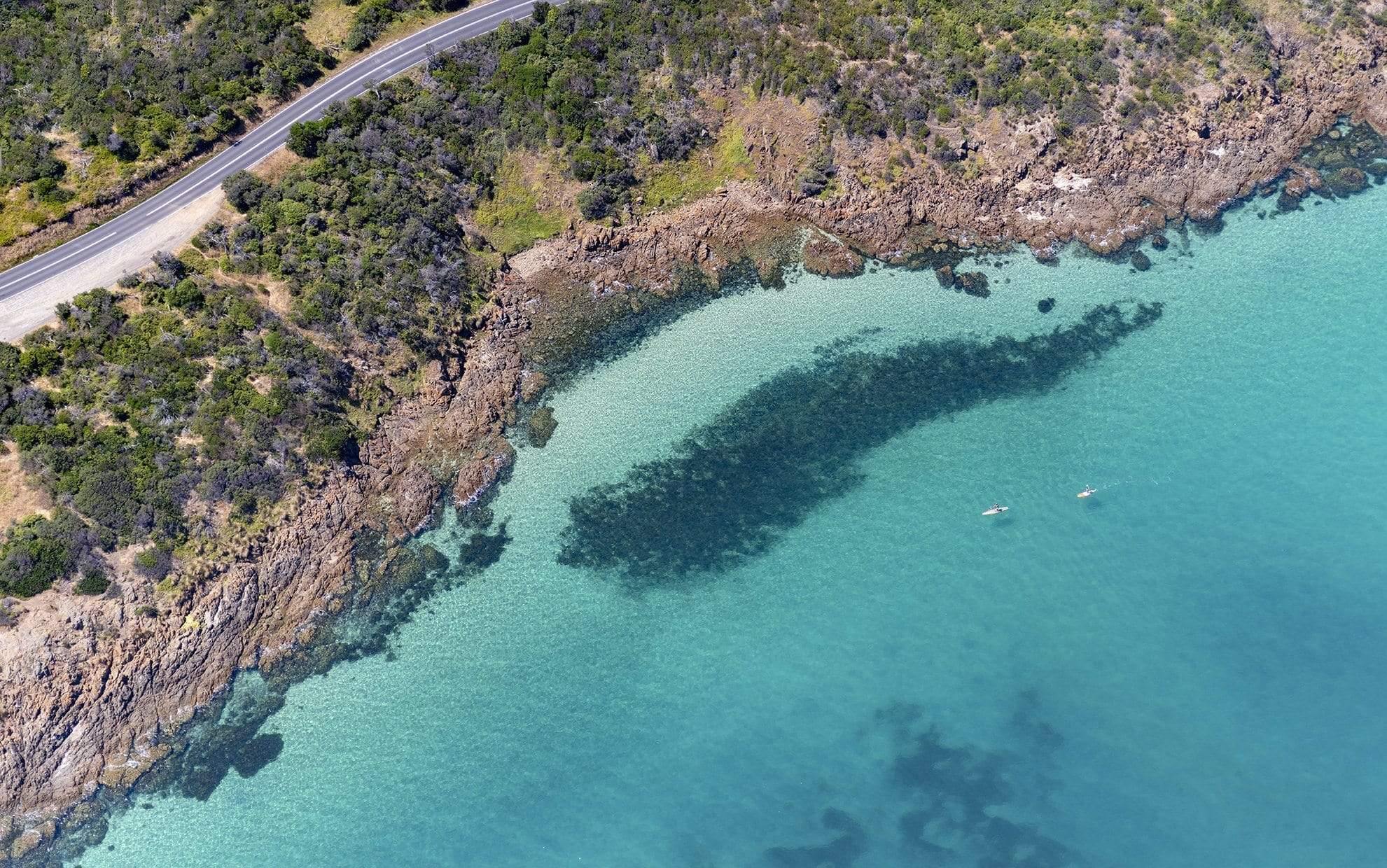 Aerial view of a seashore with a mountain wall and a road, Magical Day, Mount Martha - Mornington Peninsula VIC