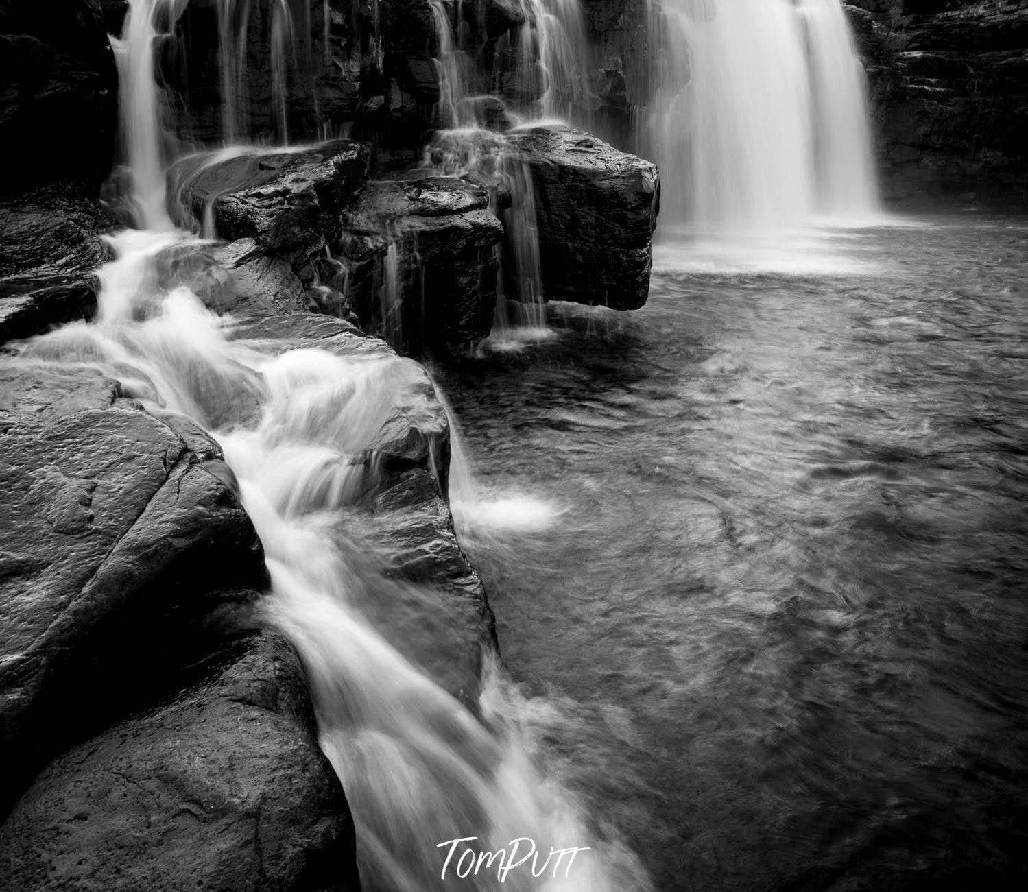 Dark waterfalls in a small lake, Manning Waterfalls, The Kimberley, Western Australia