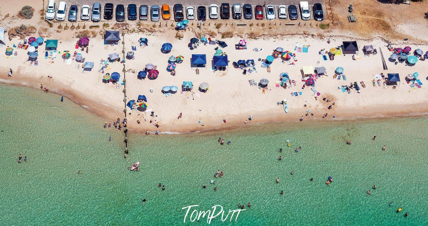 Aerial view of a green ocean with a lot of people on the beach, McCrae - Mornington Peninsula VIC