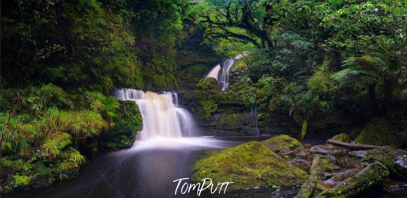 Thick waterfall from a green mound in a small lake, MacLean Falls New Zealand Art